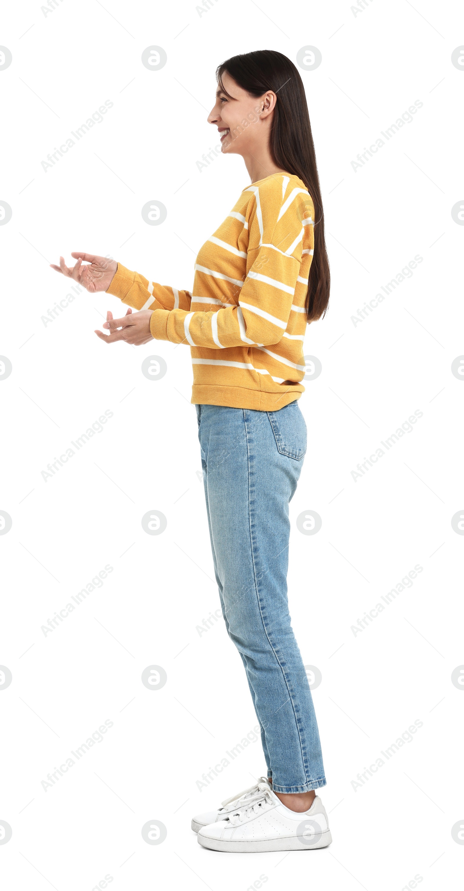 Photo of Happy woman in jeans and sweater on white background