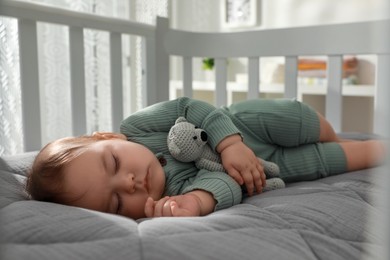 Cute little baby sleeping in crib at home. Bedtime