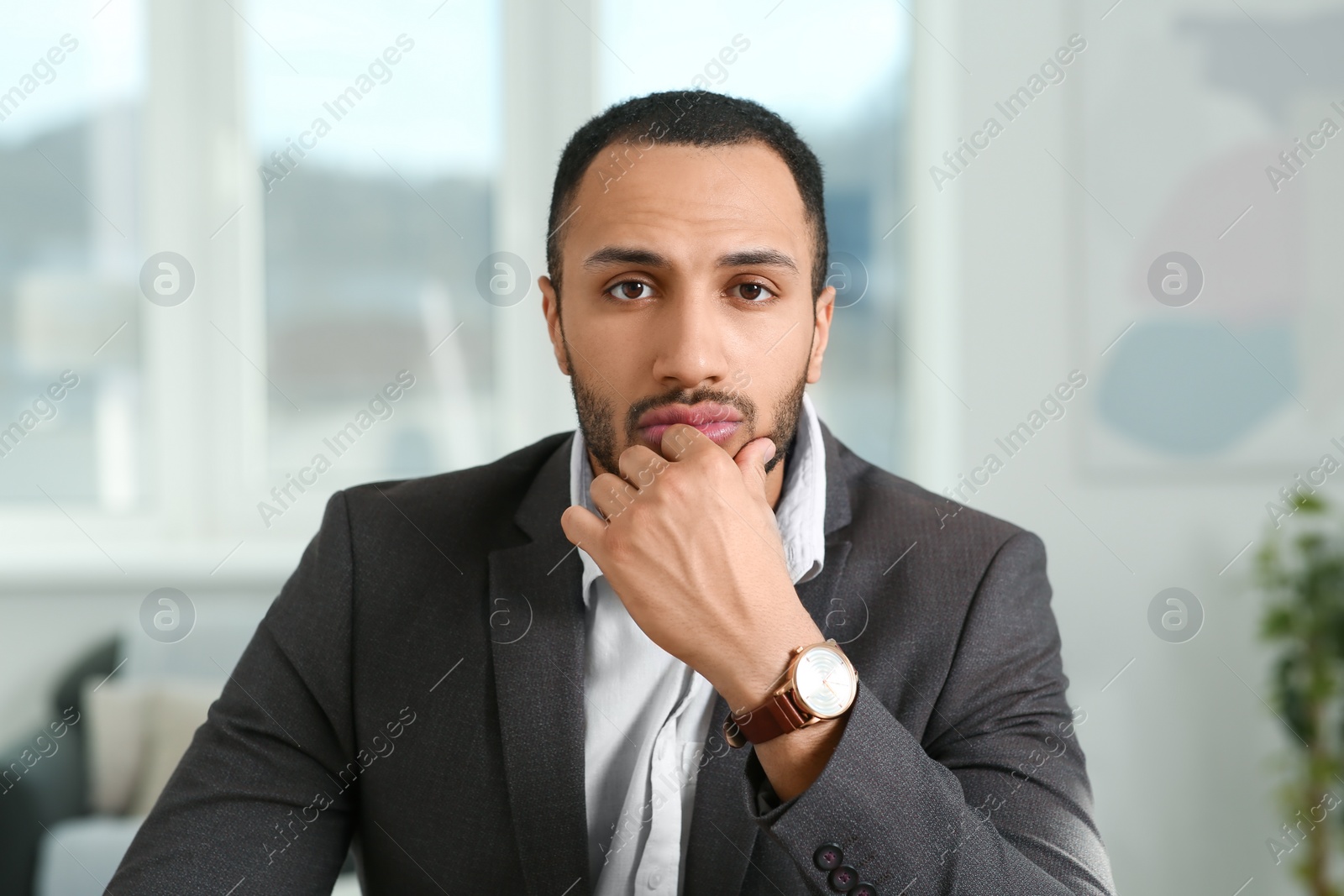 Photo of Young man having online video call at home, view from camera