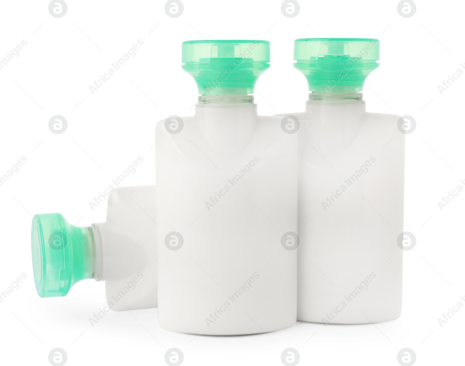 Photo of Mini bottles of cosmetic products isolated on white