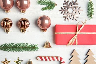 Flat lay composition with Christmas decor on white wooden background