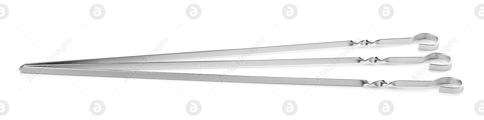 Photo of Metal skewers on white background. Barbecue utensil