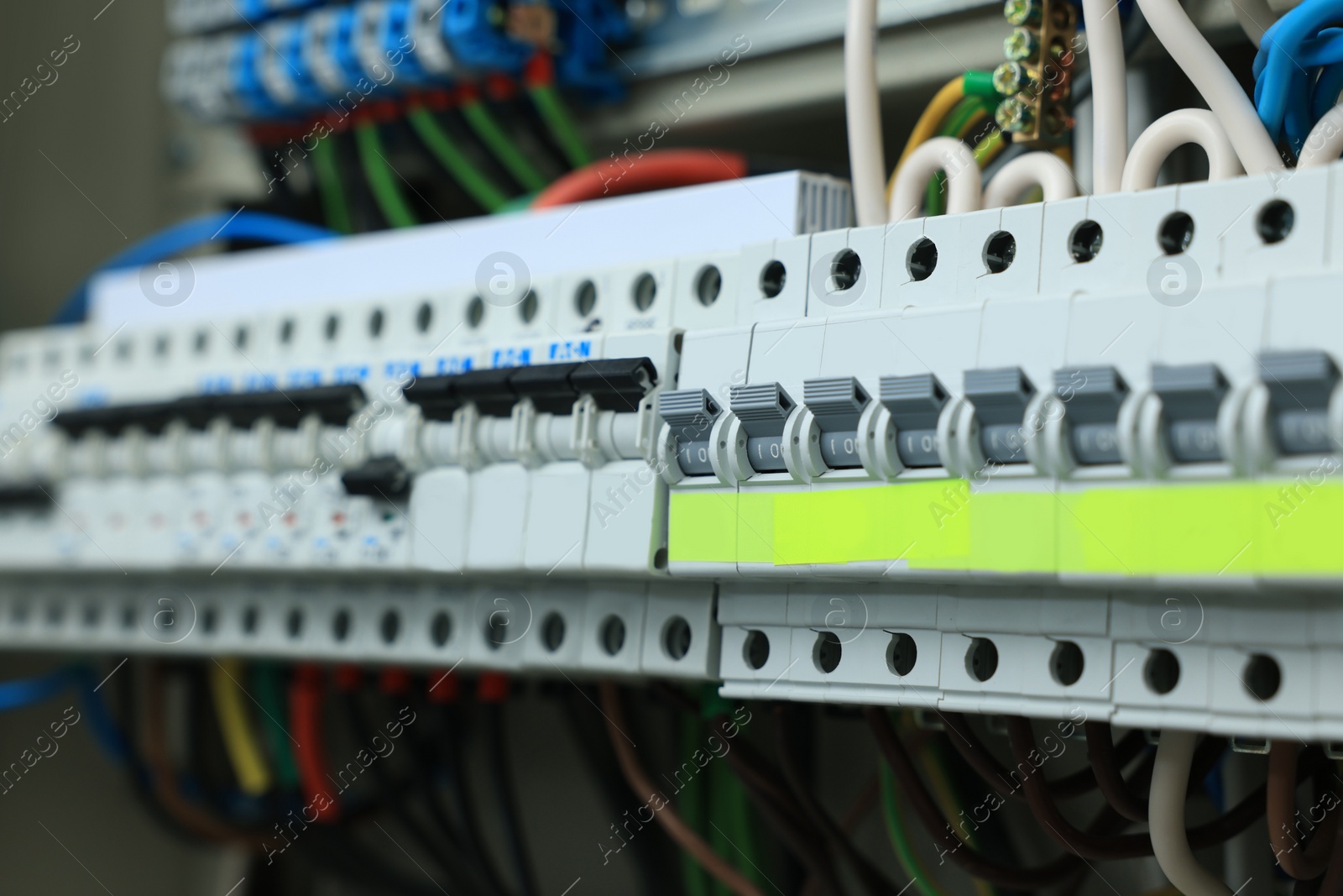 Photo of Electrical panel with many wires in fuse box, closeup