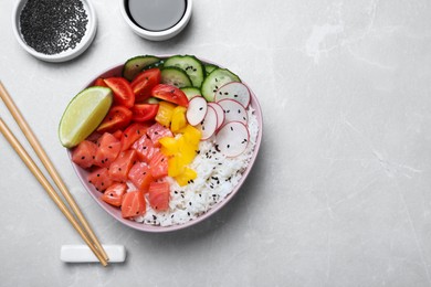 Delicious poke bowl with salmon, rice and vegetables served on light grey table, flat lay. Space for text