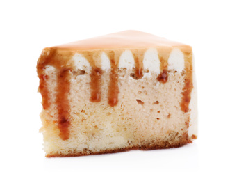 Photo of Slice of delicious cake with caramel sauce isolated on white