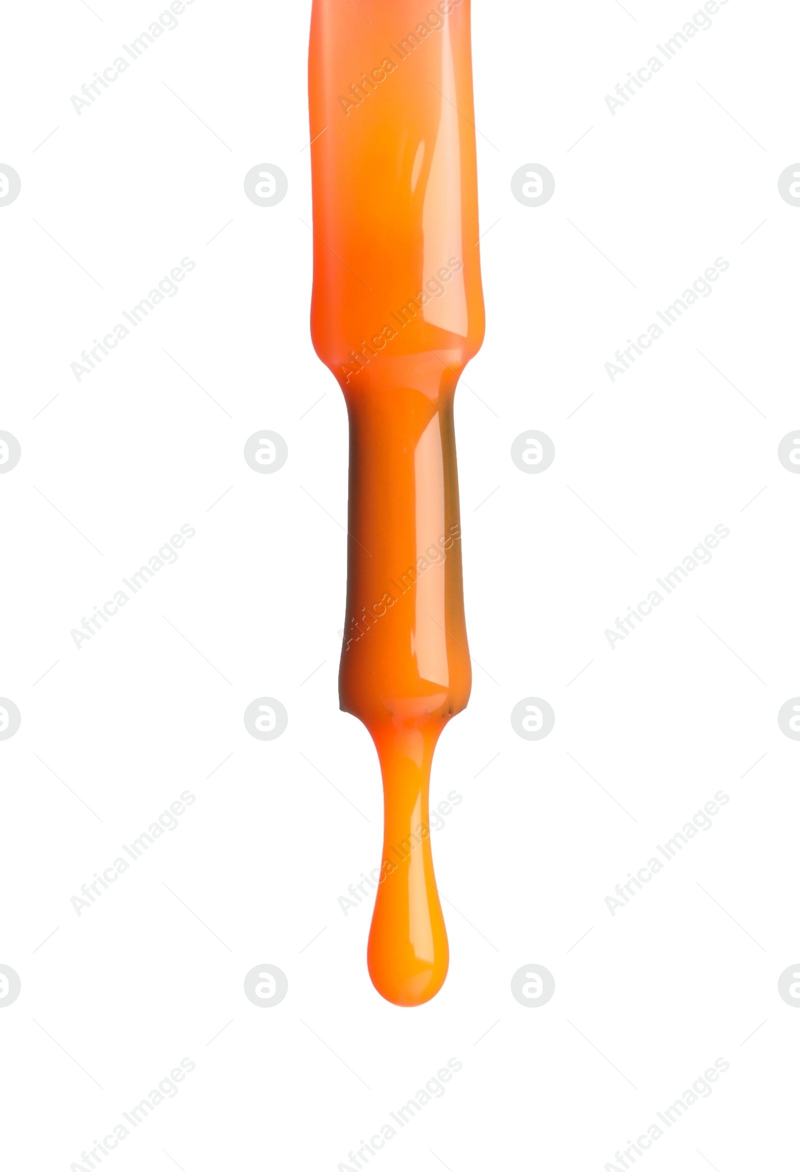 Photo of Orange nail polish dripping from brush isolated on white