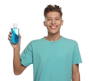 Photo of Young man with mouthwash on white background