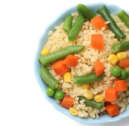 Photo of Delicious bulgur with vegetables in bowl isolated on white, top view