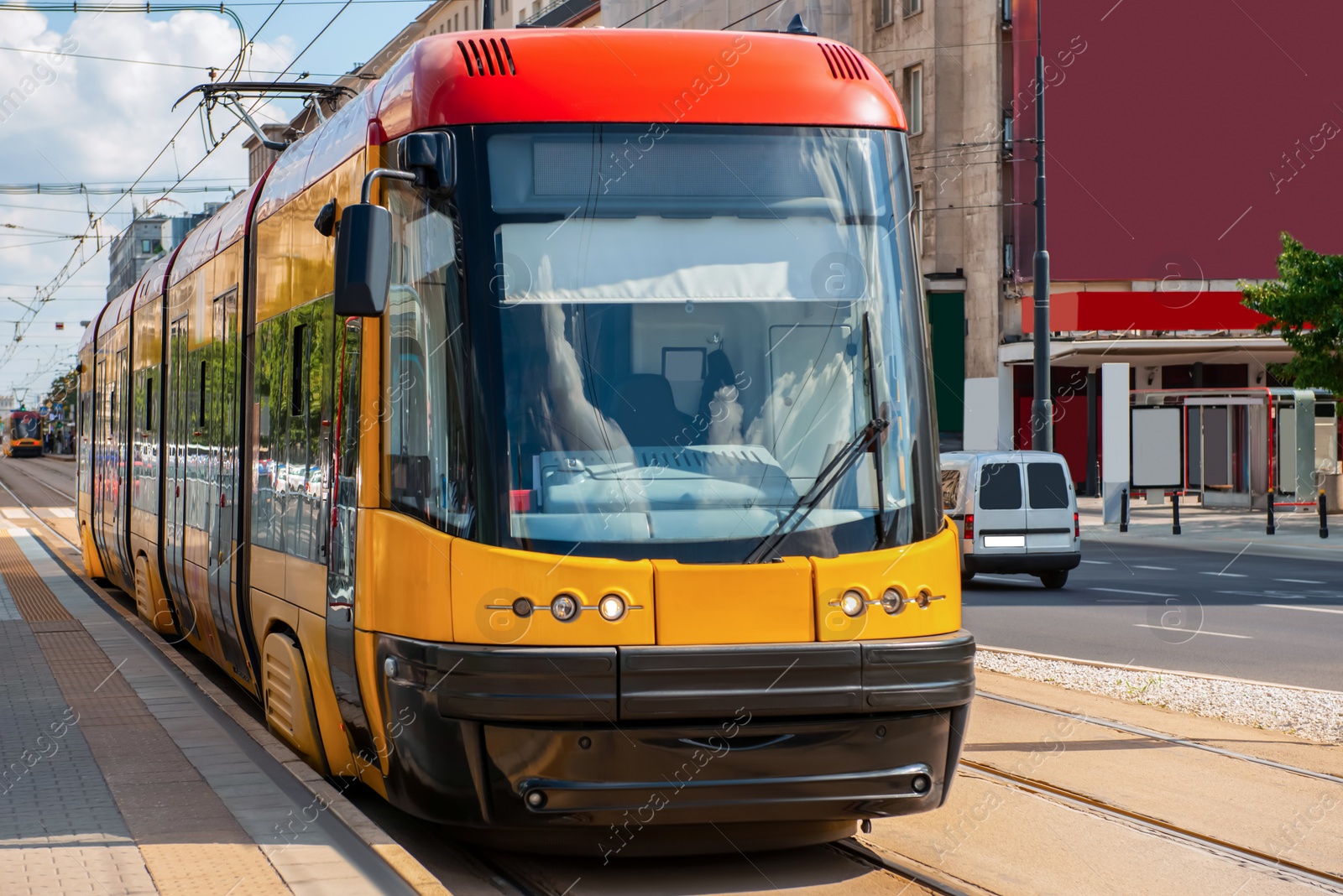 Photo of Streetcar on road in city. Public transport