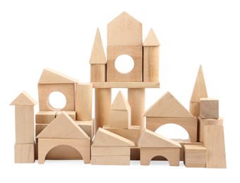 Photo of Building made of wooden blocks isolated on white. Children's toys