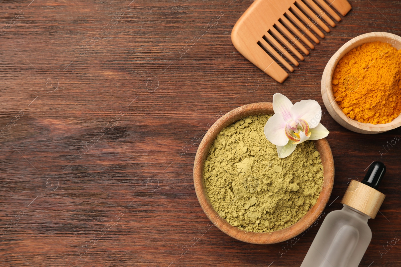 Photo of Flat lay composition with henna and turmeric powder on wooden table, space for text