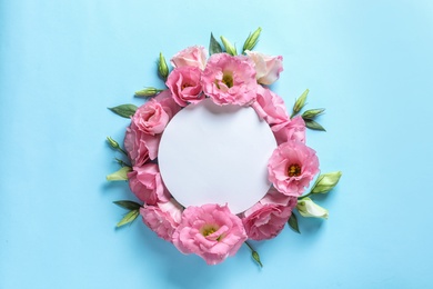 Photo of Flat lay composition with beautiful Eustoma flowers on color background