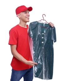 Dry-cleaning delivery. Happy courier holding dress in plastic bag on white background