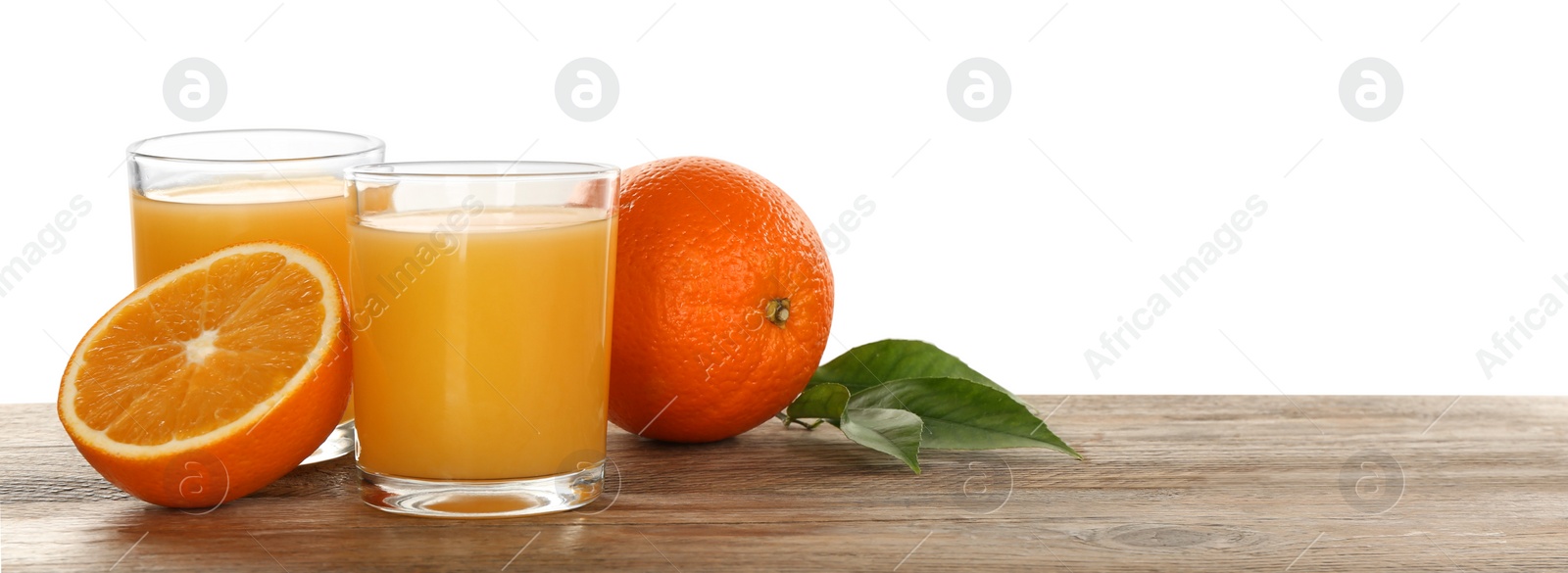 Photo of Delicious orange juice and fresh fruits on wooden table against white background. Space for text