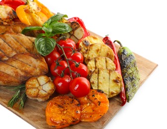 Photo of Wooden board with tasty grilled vegetables, meat, rosemary and basil isolated on white