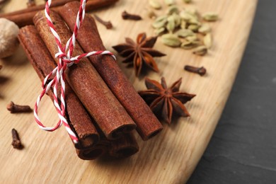 Cinnamon sticks and other spices on table, closeup