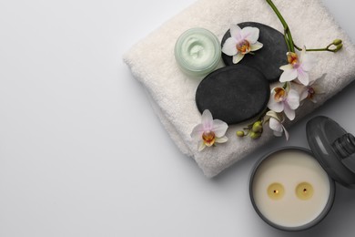 Flat lay composition with different spa products on white background. Space for text