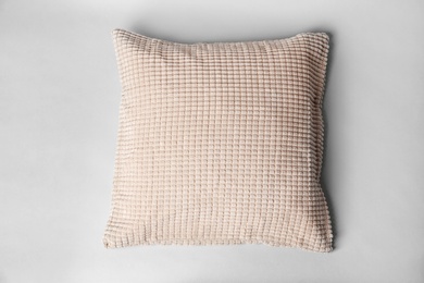 Soft decorative pillow on light background