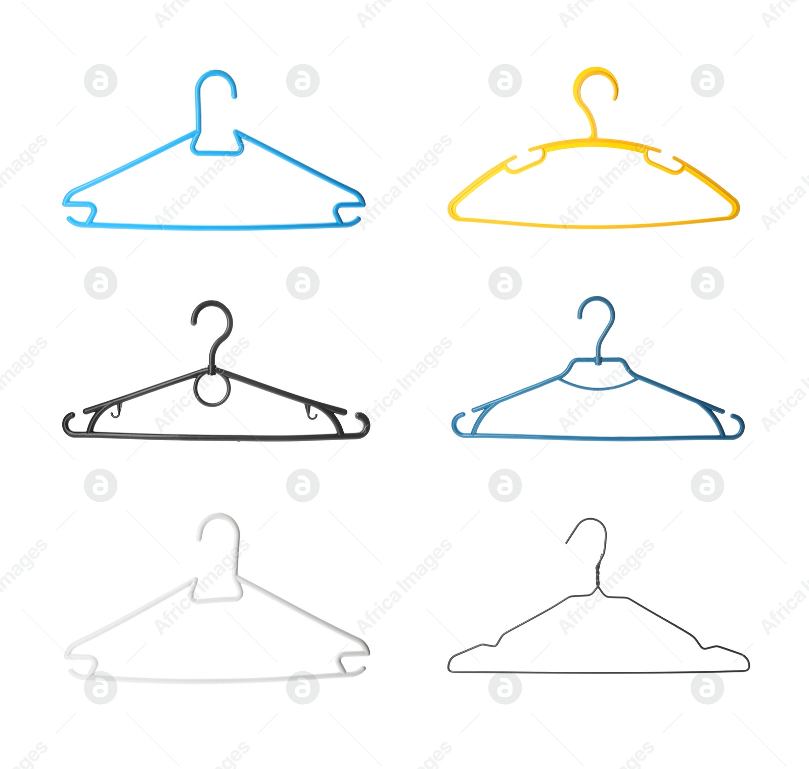 Image of Set with different empty hangers on white background