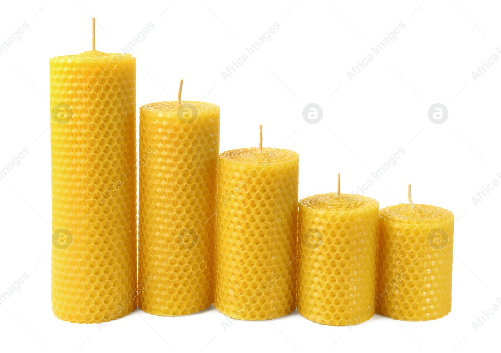 Photo of Stylish elegant beeswax candles isolated on white