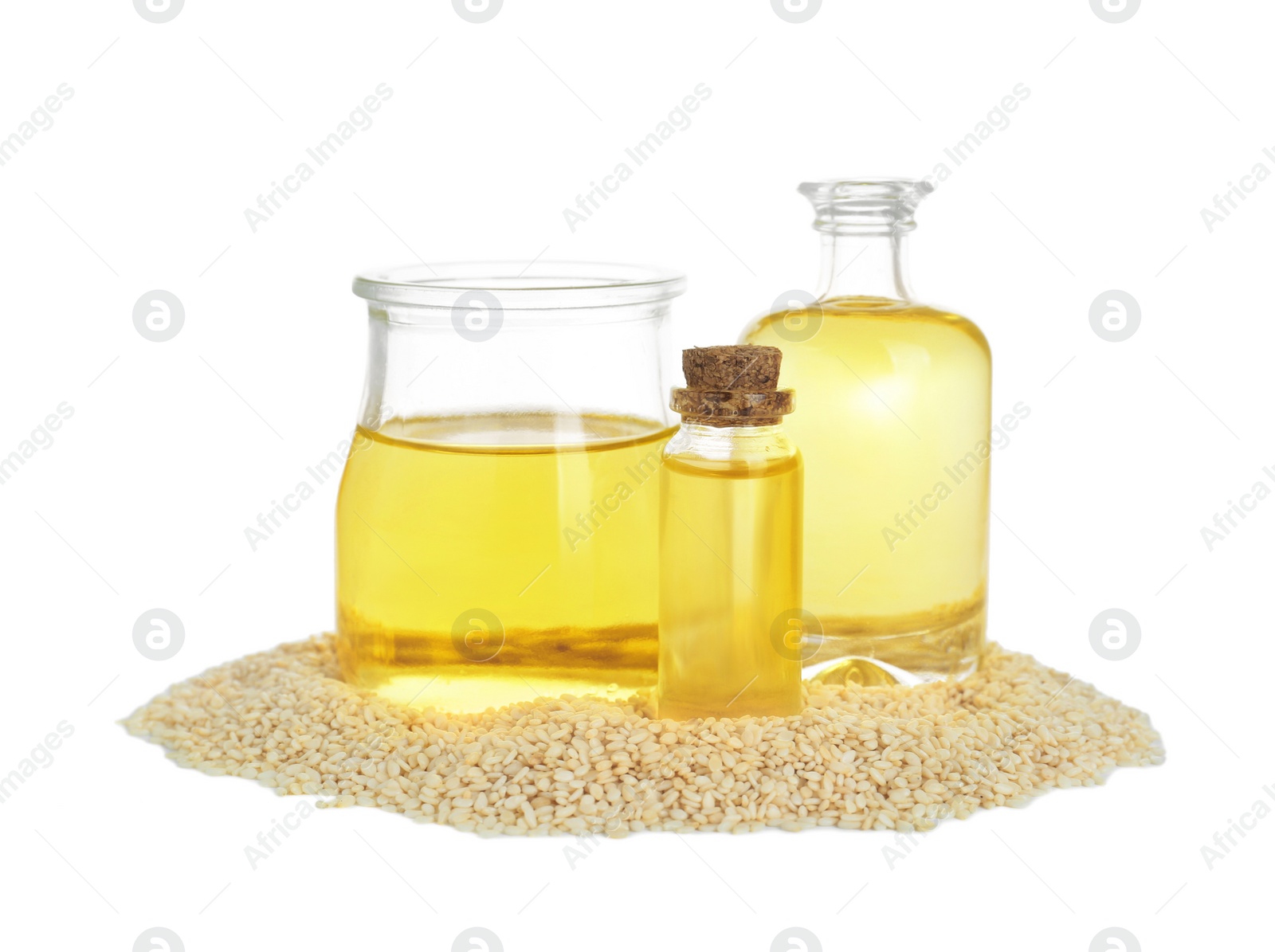 Photo of Fresh sesame oil and seeds isolated on white