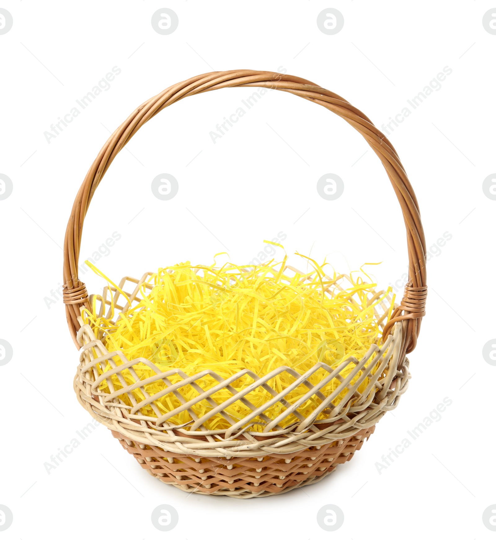 Photo of Wicker basket with yellow filler isolated on white. Easter item