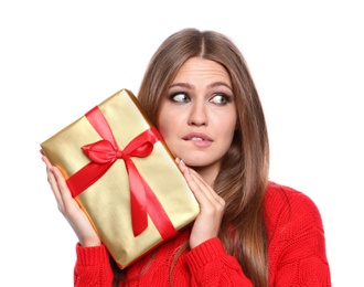 Photo of Emotional young woman with Christmas gift on white background