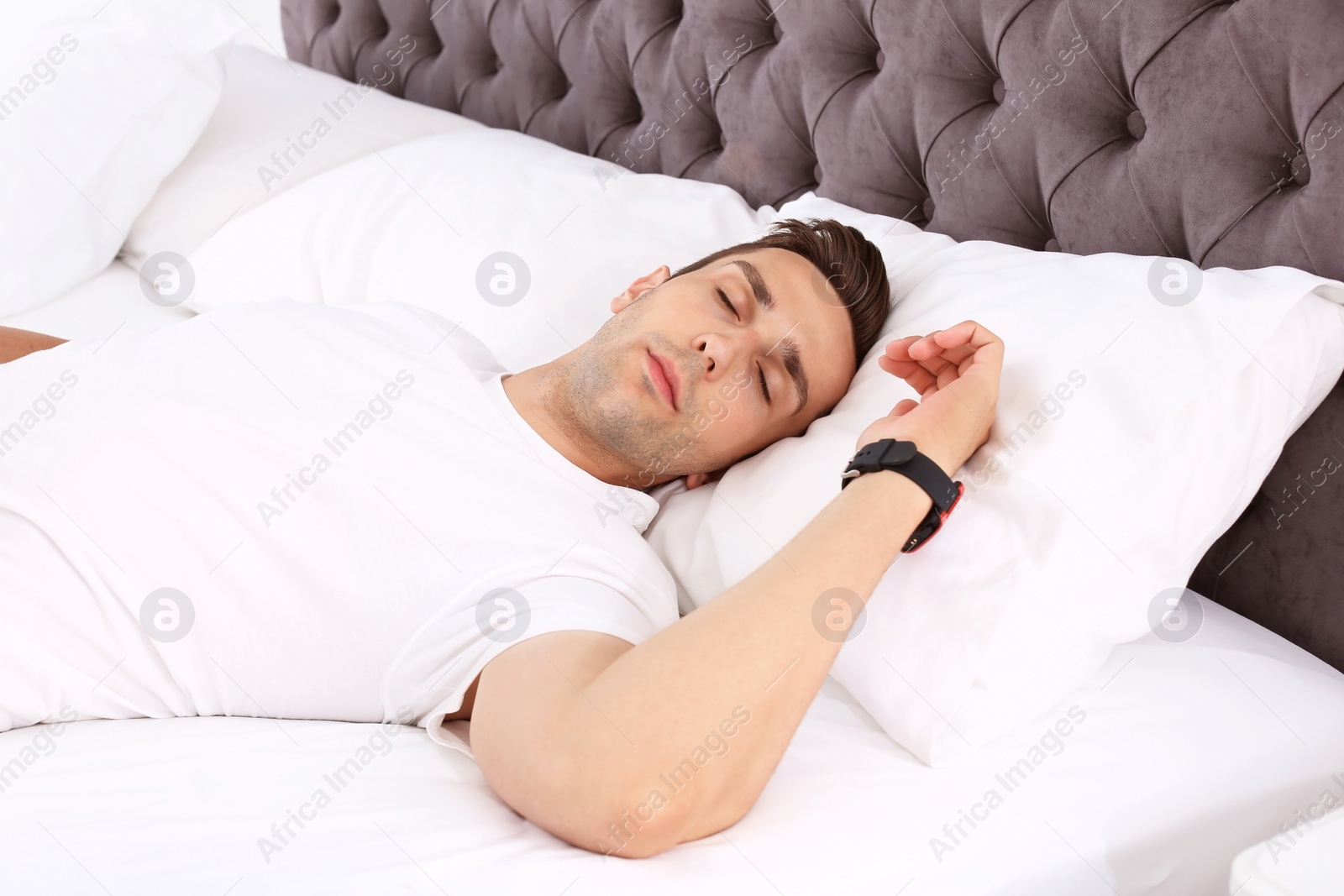 Photo of Young man sleeping in bed at home