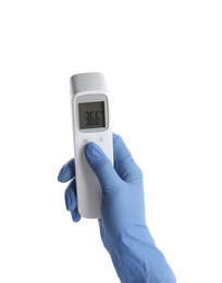 Photo of Doctor with infrared thermometer on white background, closeup. Checking temperature during Covid-19 pandemic