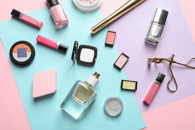 Photo of Decorative cosmetics and tools of professional makeup artist on color background