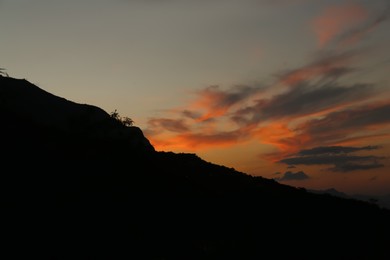 Picturesque view of big hill at beautiful sunset