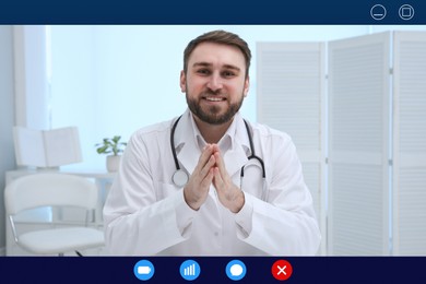 Pediatrician consulting patient online using video chat in clinic, view from webcam