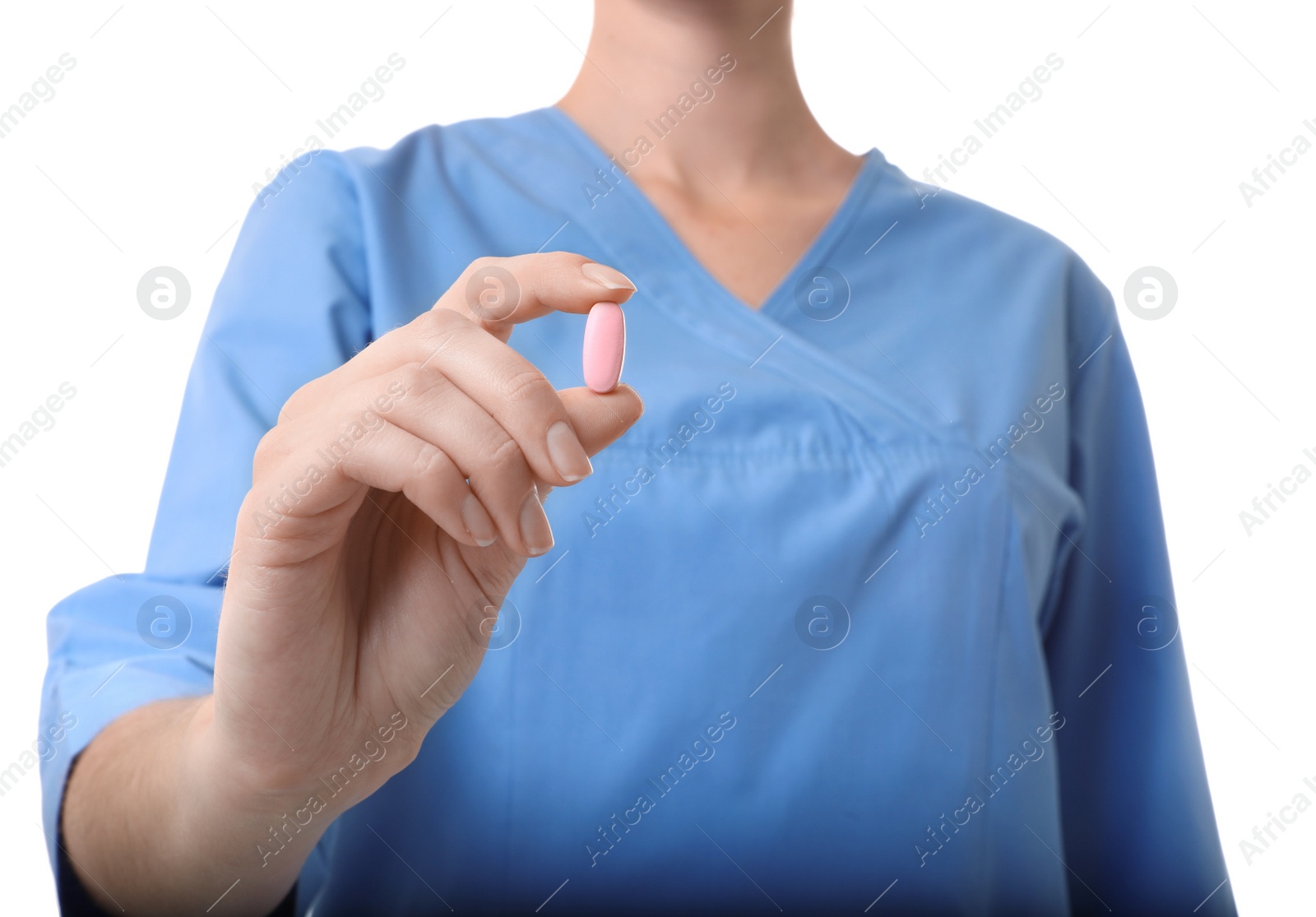 Photo of Female doctor holding pill on white background, closeup. Medical object