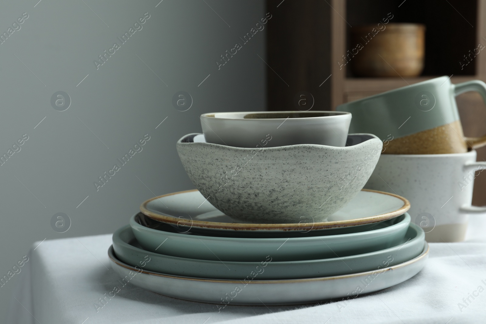 Photo of Stylish empty dishware on table, closeup. Space for text