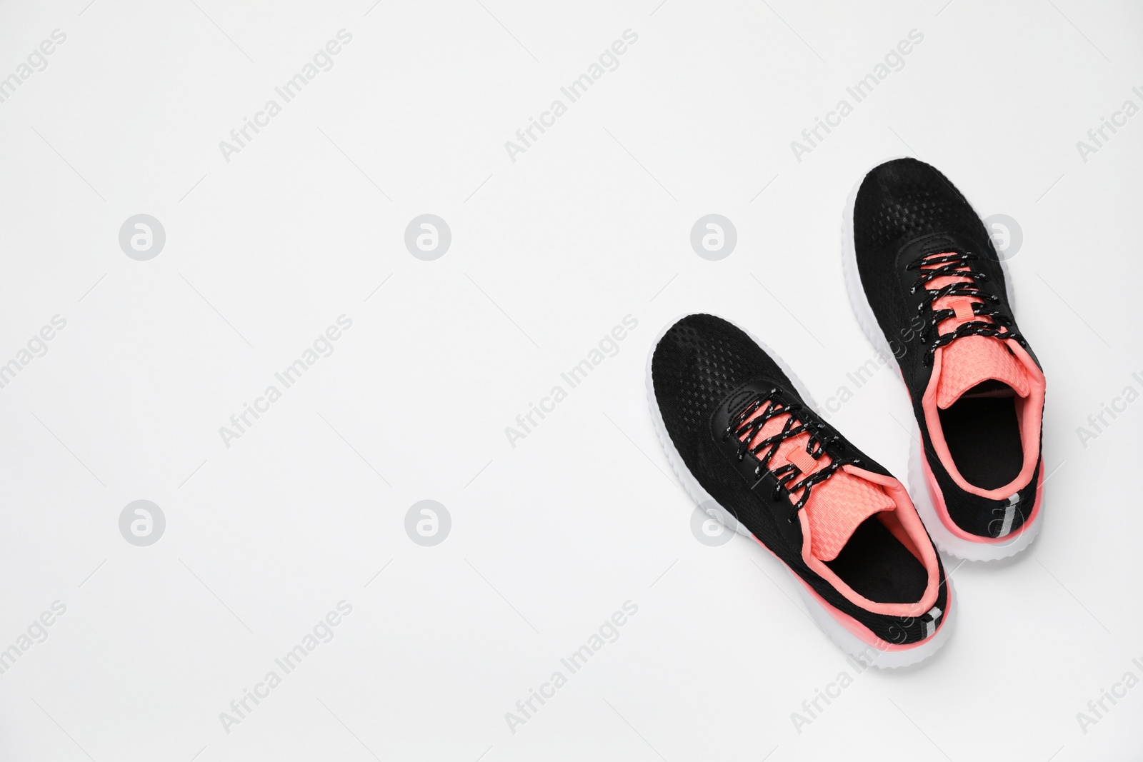 Photo of Pair of stylish sport shoes on white background, flat lay. Space for text