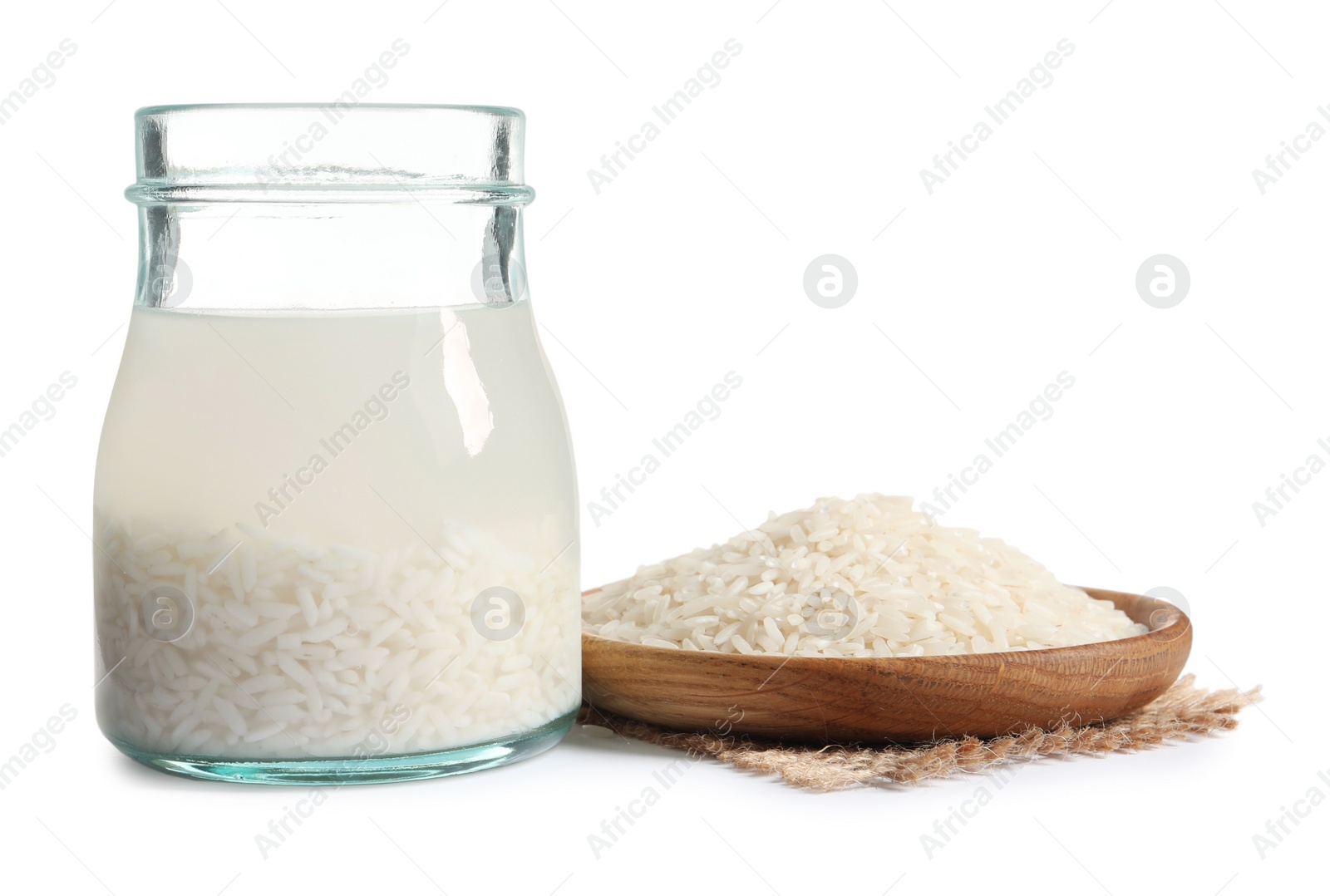 Photo of Rice soaked in water on white background