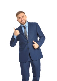 Young businessman celebrating victory on white background