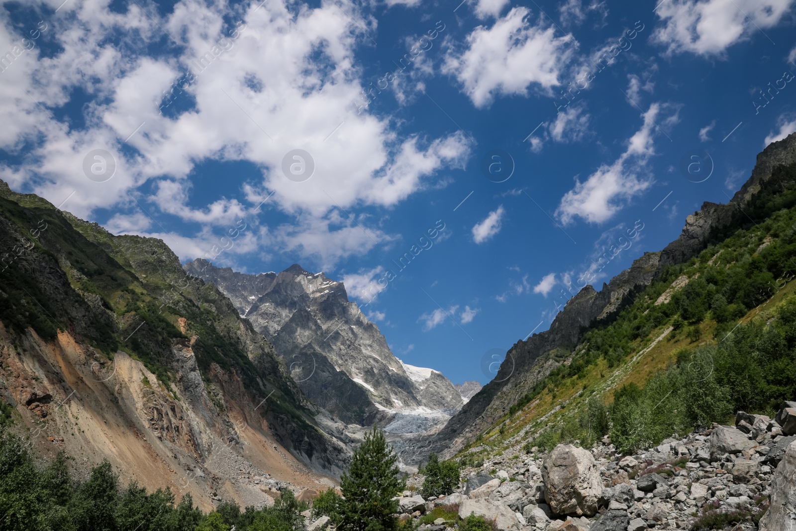 Photo of Picturesque view of mountains under cloudy sky