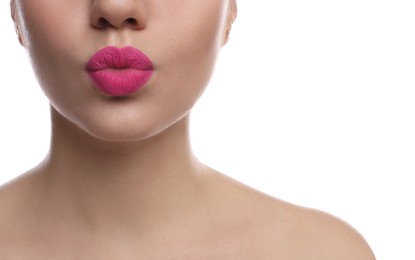 Photo of Closeup view of beautiful woman puckering lips for kiss on white background