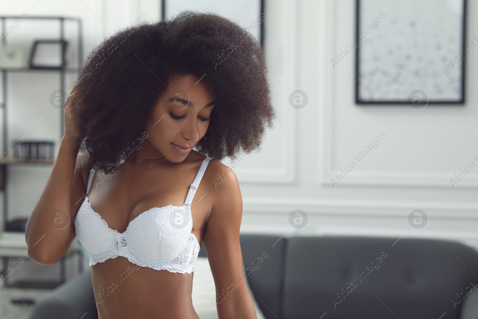Photo of Beautiful woman in elegant white underwear indoors, space for text