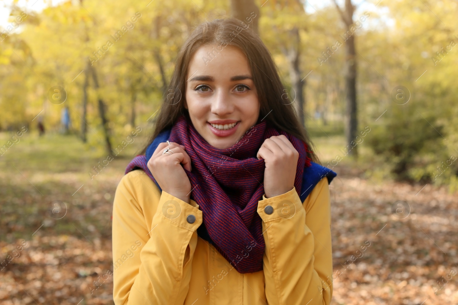 Photo of Portrait of young beautiful woman in park. Autumn walk