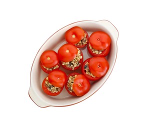 Delicious stuffed tomatoes with minced beef, bulgur and mushrooms in baking dish isolated on white, top view