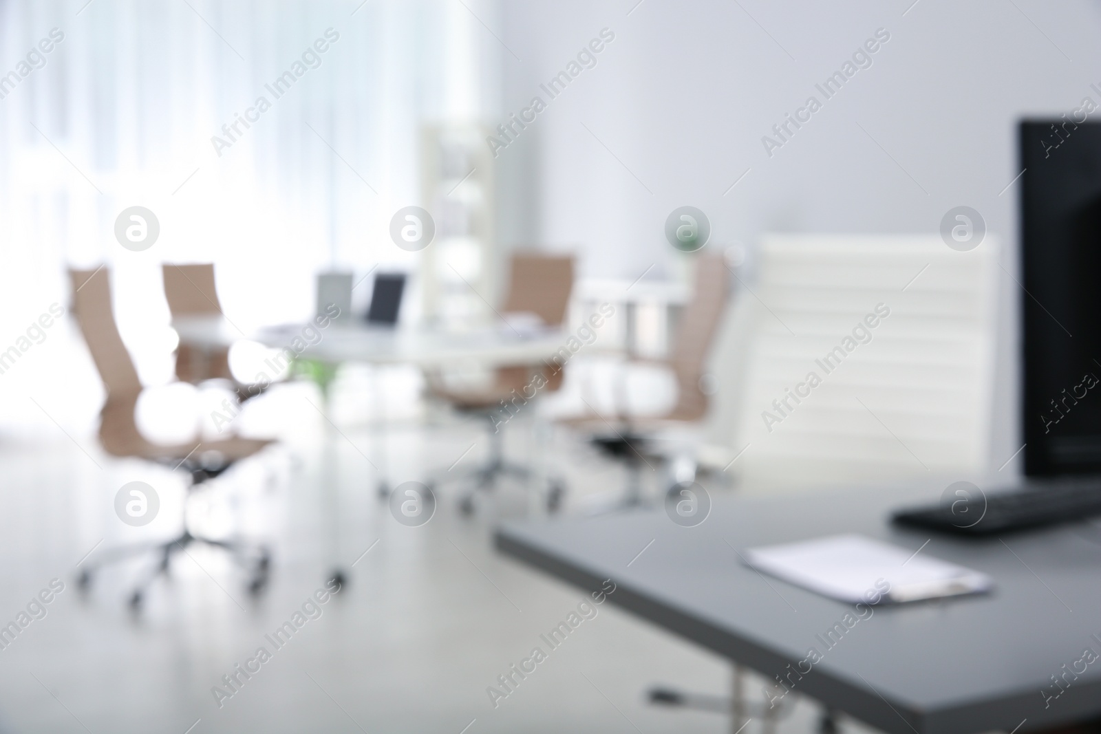 Photo of Modern brightly lit office with bokeh effect