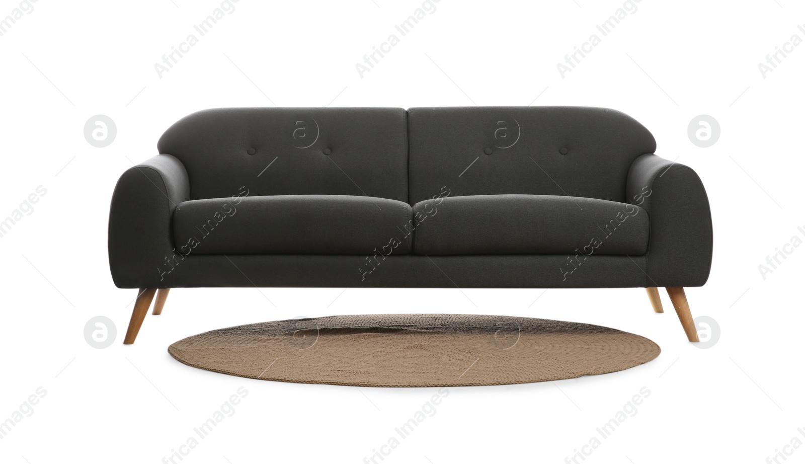 Photo of Comfortable grey sofa and rug on white background. Furniture for living room interior