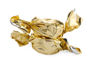 Photo of Candies in golden wrappers isolated on white