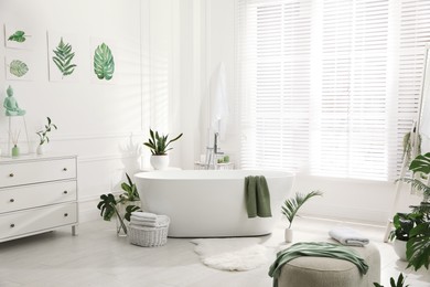 Stylish bathroom interior with green plants. Home design