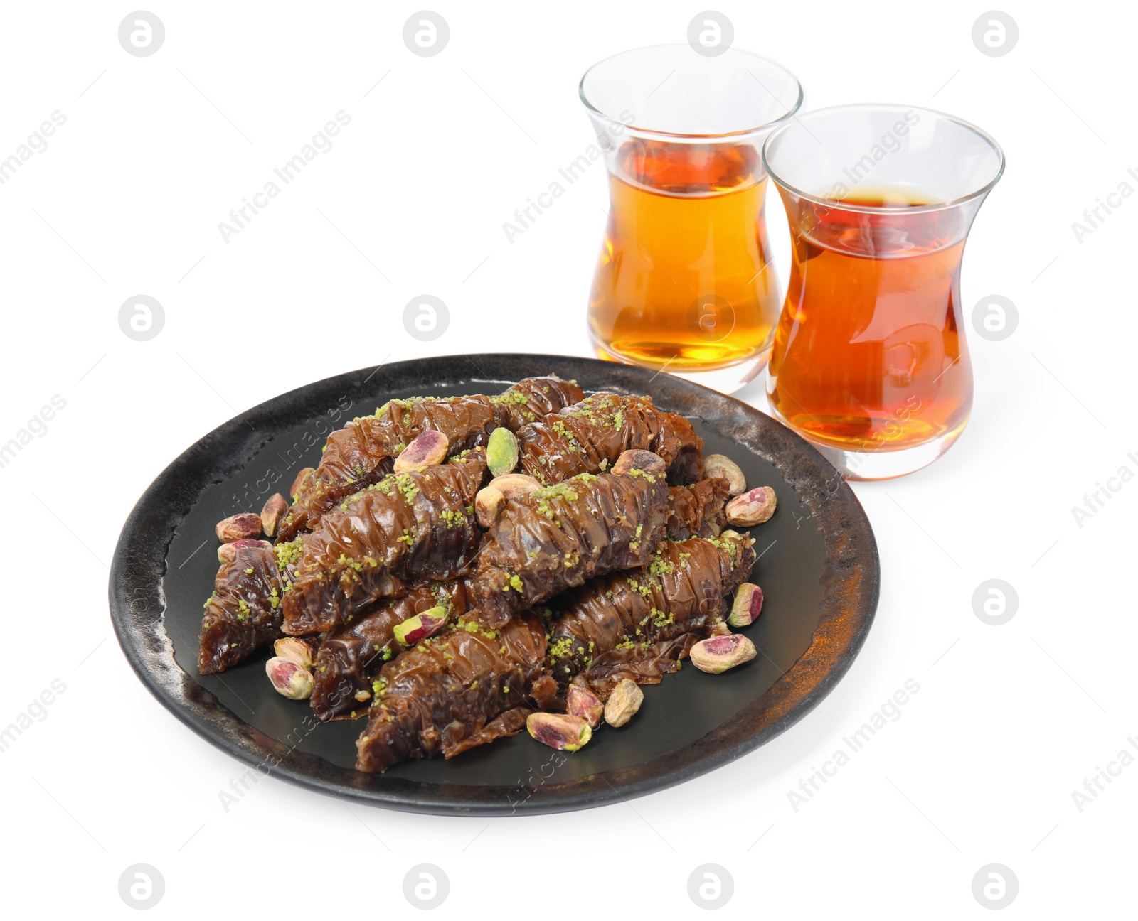 Photo of Delicious baklava with pistachios and hot tea on white background