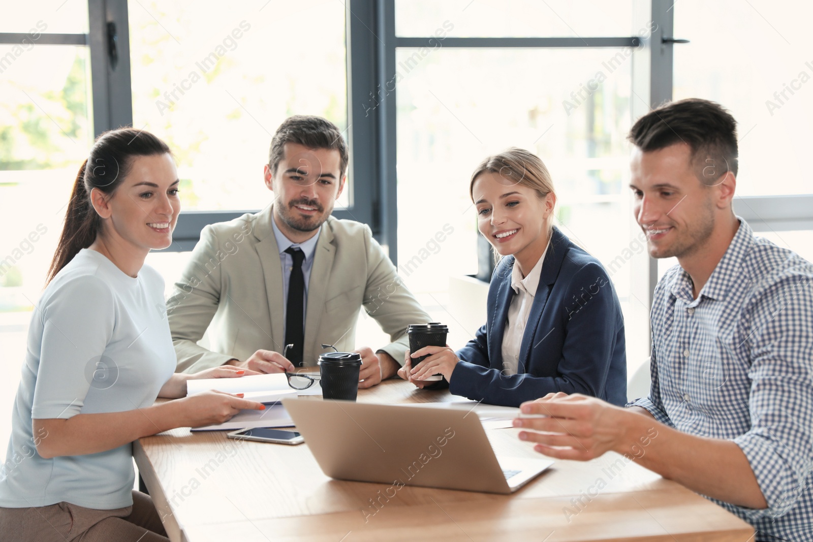 Photo of Office employees having business training at workplace