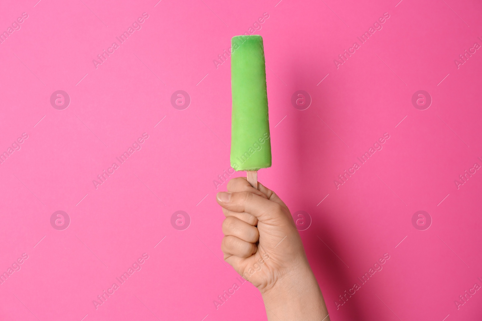 Photo of Woman holding delicious ice cream against color background