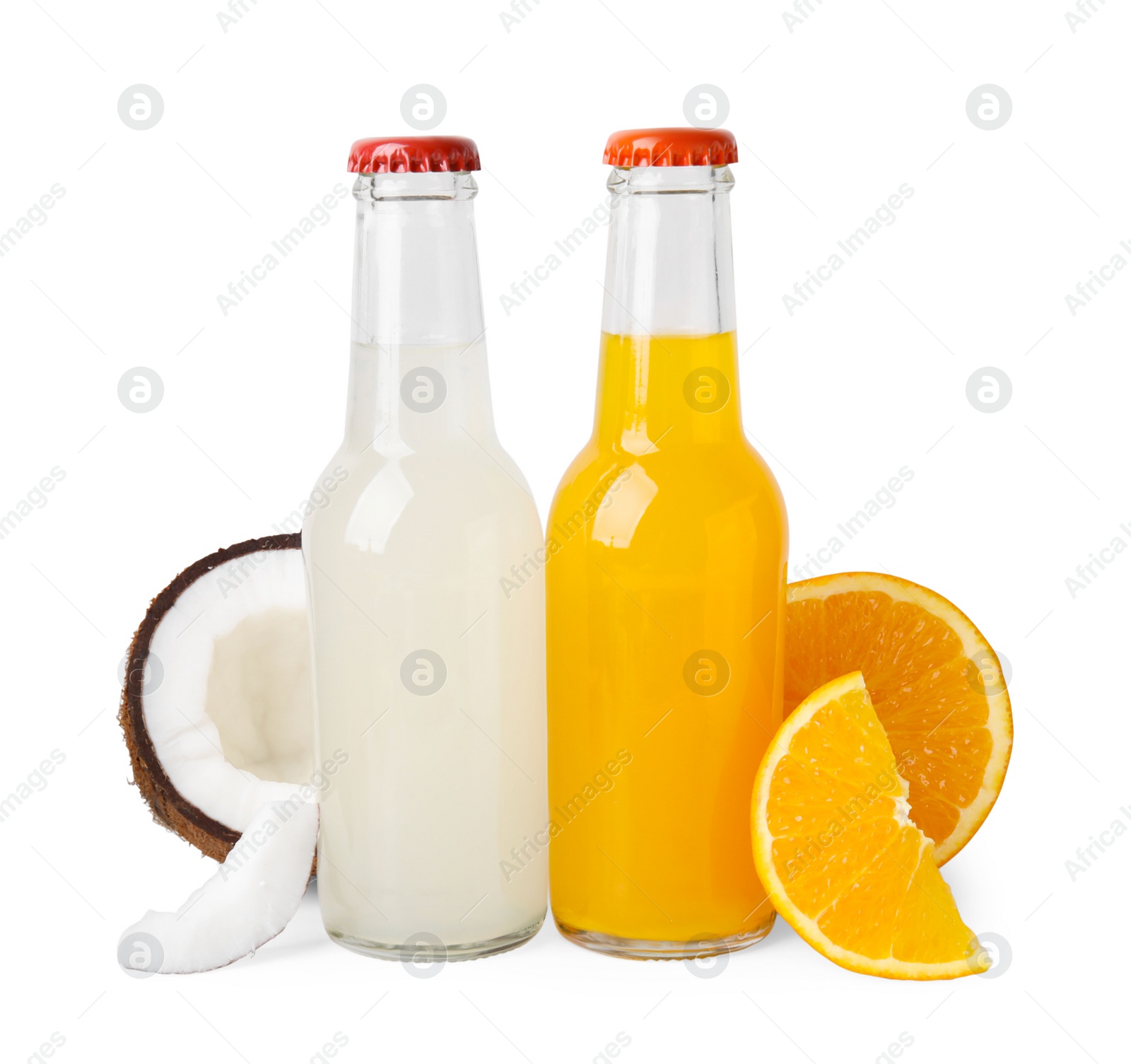 Photo of Delicious kombucha in glass bottles, coconut and orange isolated on white